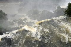 33 Water Rushing Over The Edge Of Iguazu Falls From Paseo Superior Upper Trail In Argentina.jpg